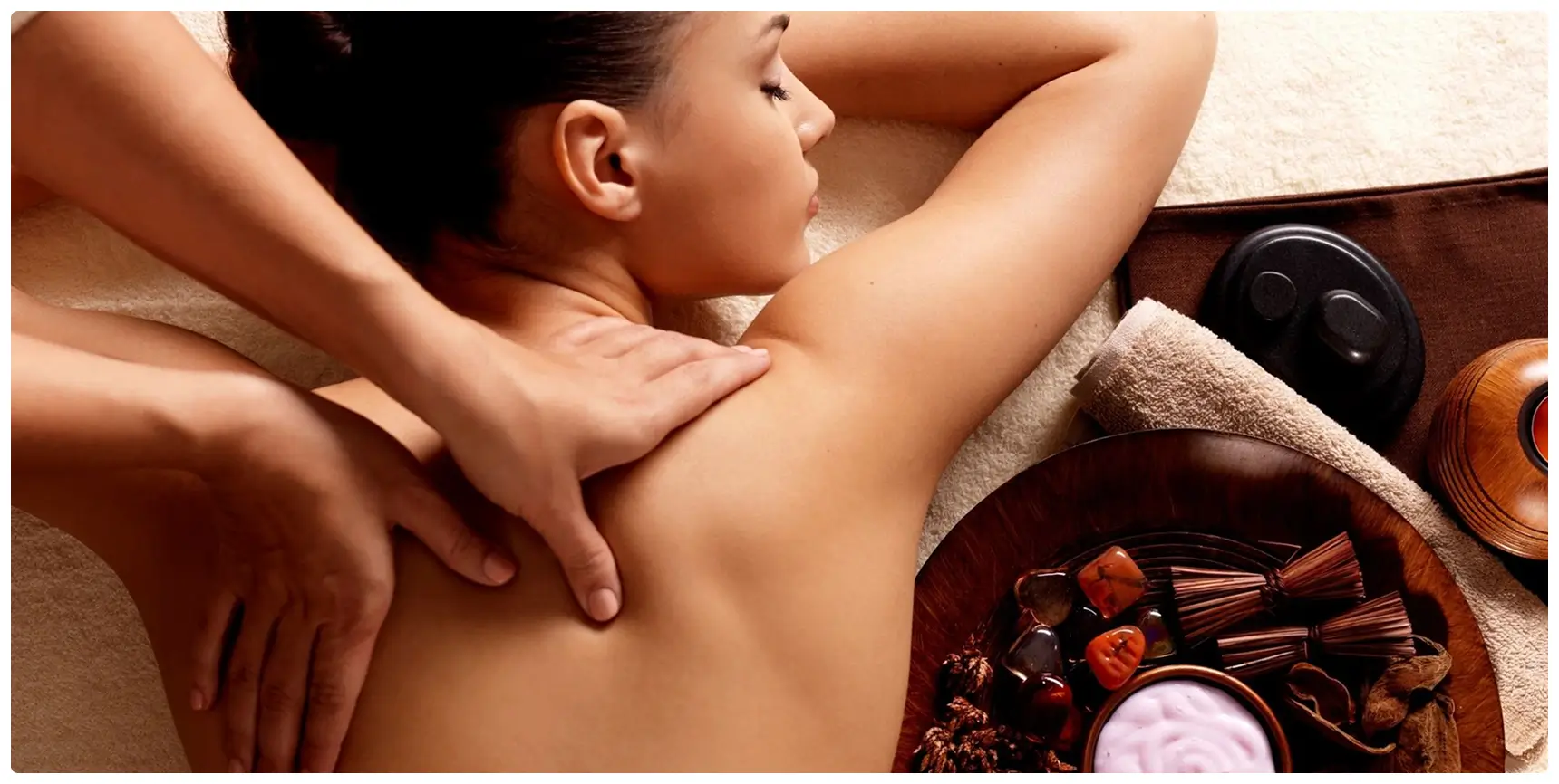 A person receiving a relaxing shoulder massage at a spa.